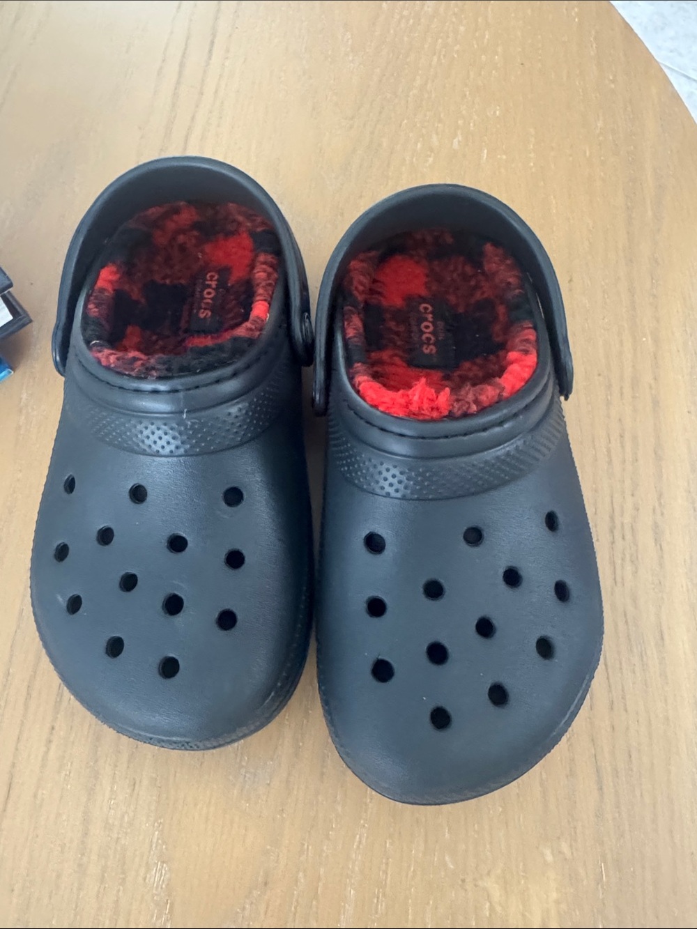 CROCS Kids Black Clogs with Red Plaid Fuzzy Lining